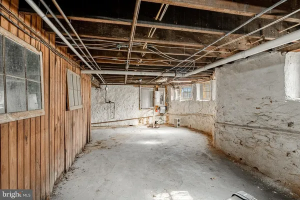 a view of empty room with wooden walls
