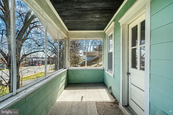 a bathroom with a bathtub and window