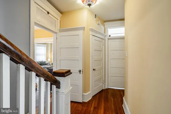a view of entryway with a window and wooden floor