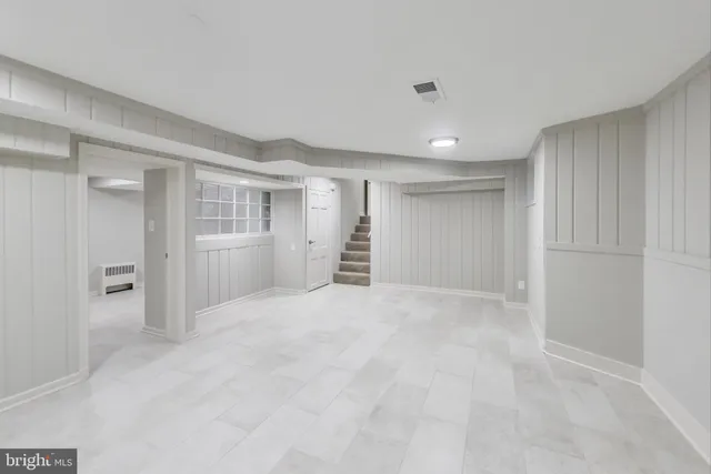 a bathroom with a shower and a sink