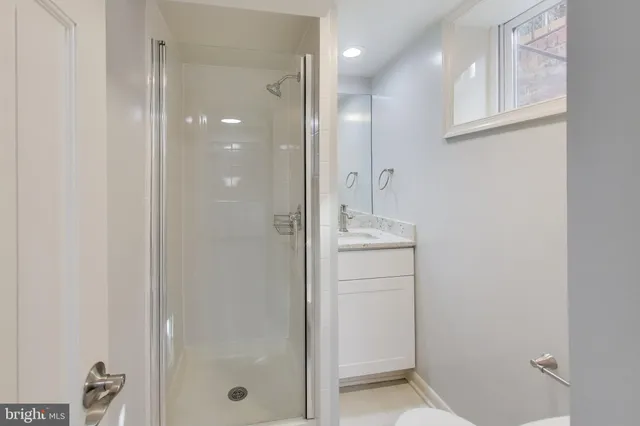 a utility room with cabinets washer and dryer