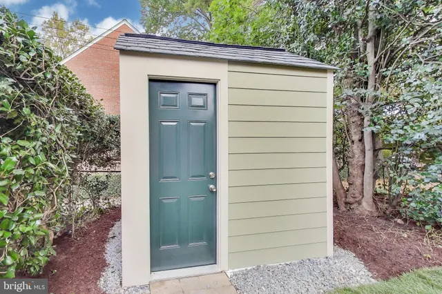front view of a house with a tree