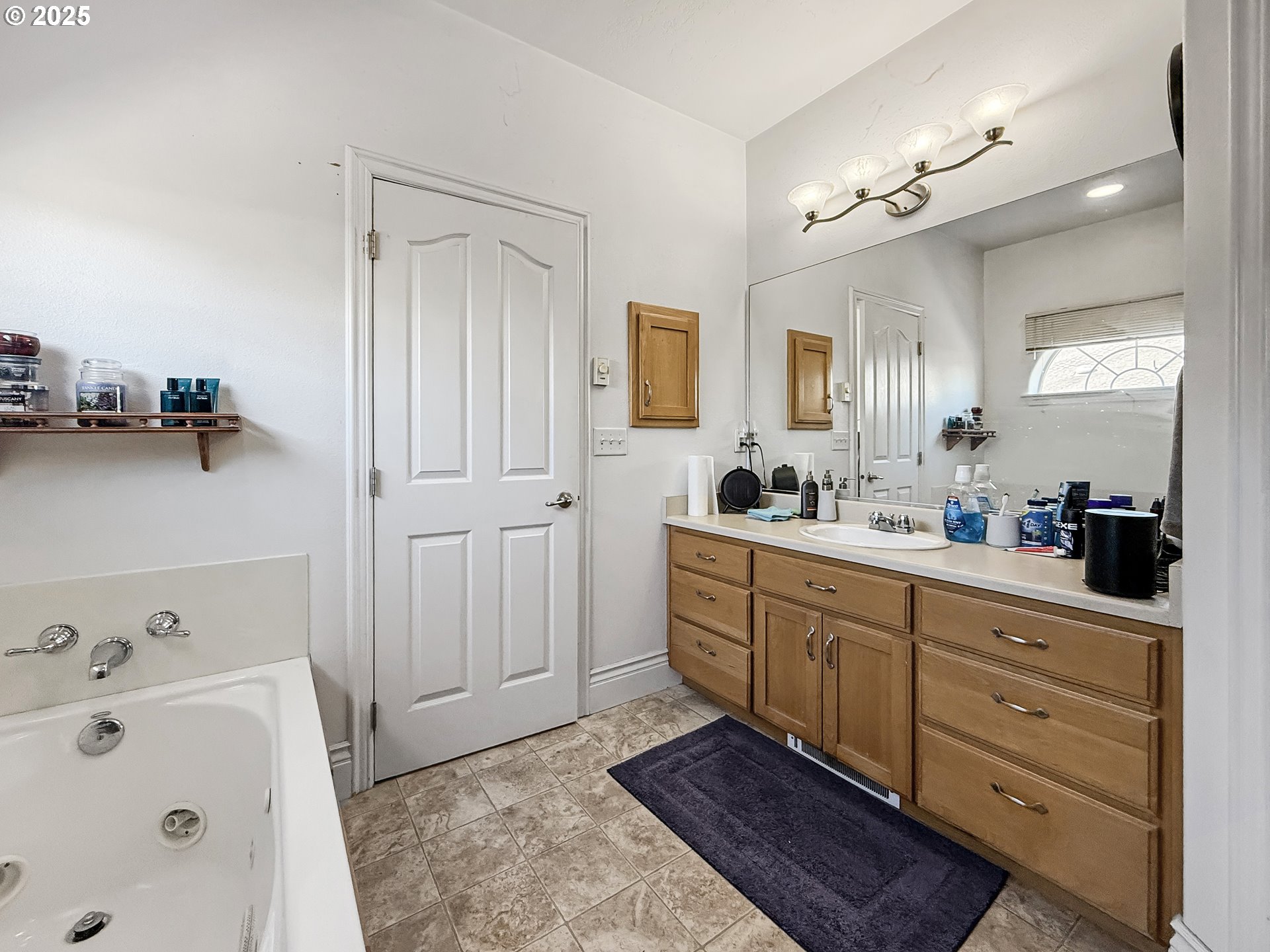 731 3rd Street, Unit C / 3 Brookings, OR 97415 - Photo 30 of 42 a spacious bathroom with a tub sink and mirror