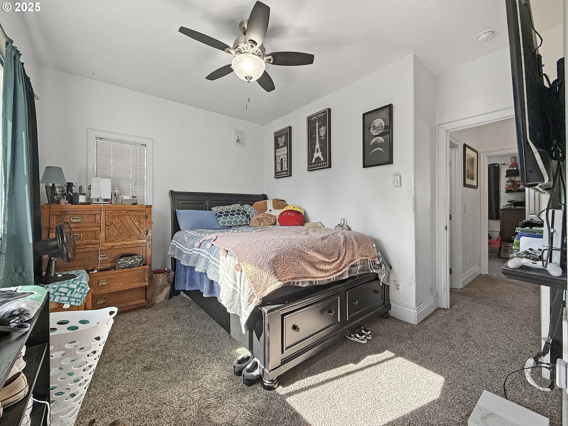 731 3rd Street, Unit C / 3 Brookings, OR 97415 - Photo 33 of 42 a bedroom with a bed and a chandelier