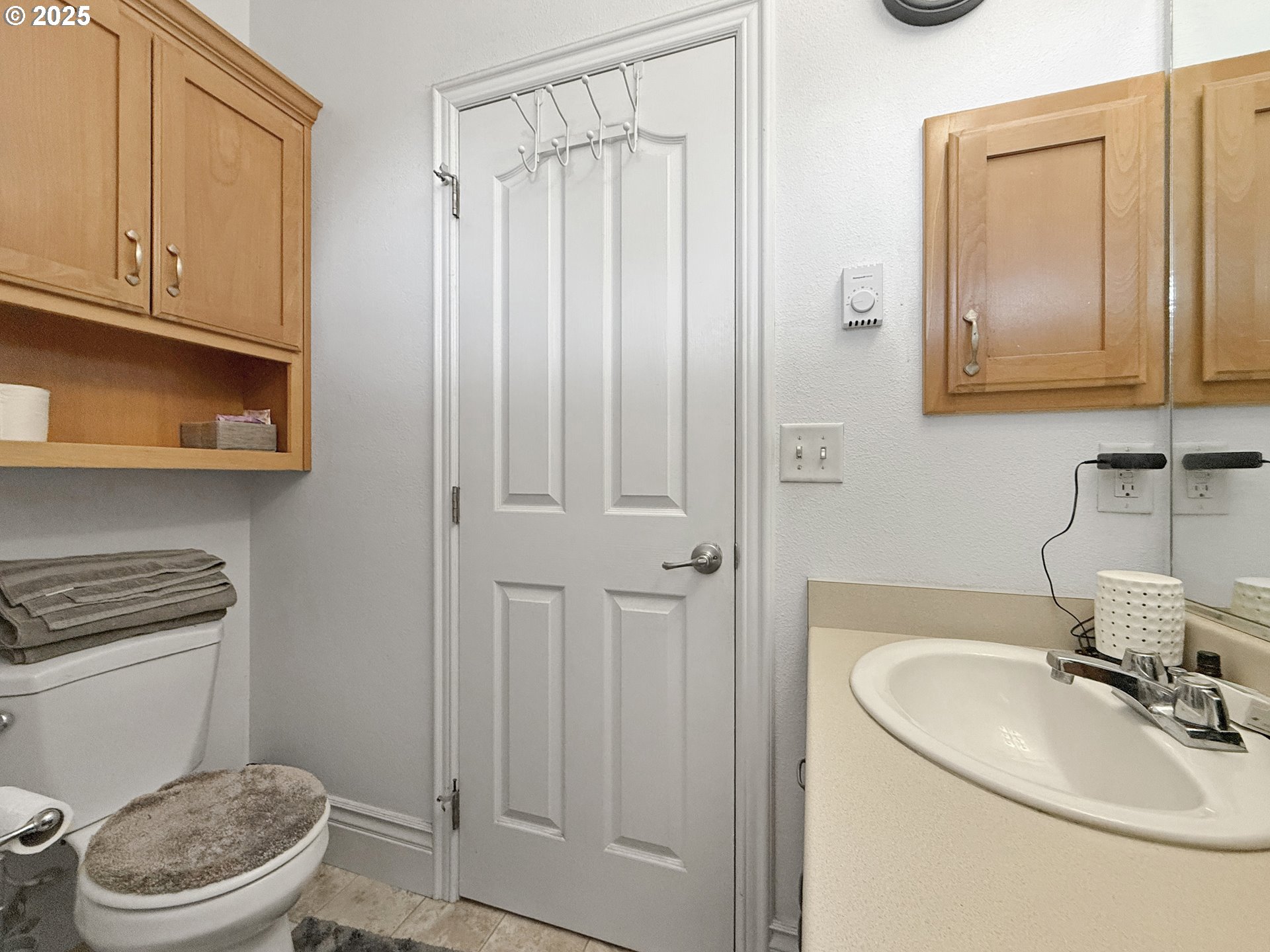 731 3rd Street, Unit C / 3 Brookings, OR 97415 - Photo 37 of 42 a bathroom with a sink a toilet and mirror