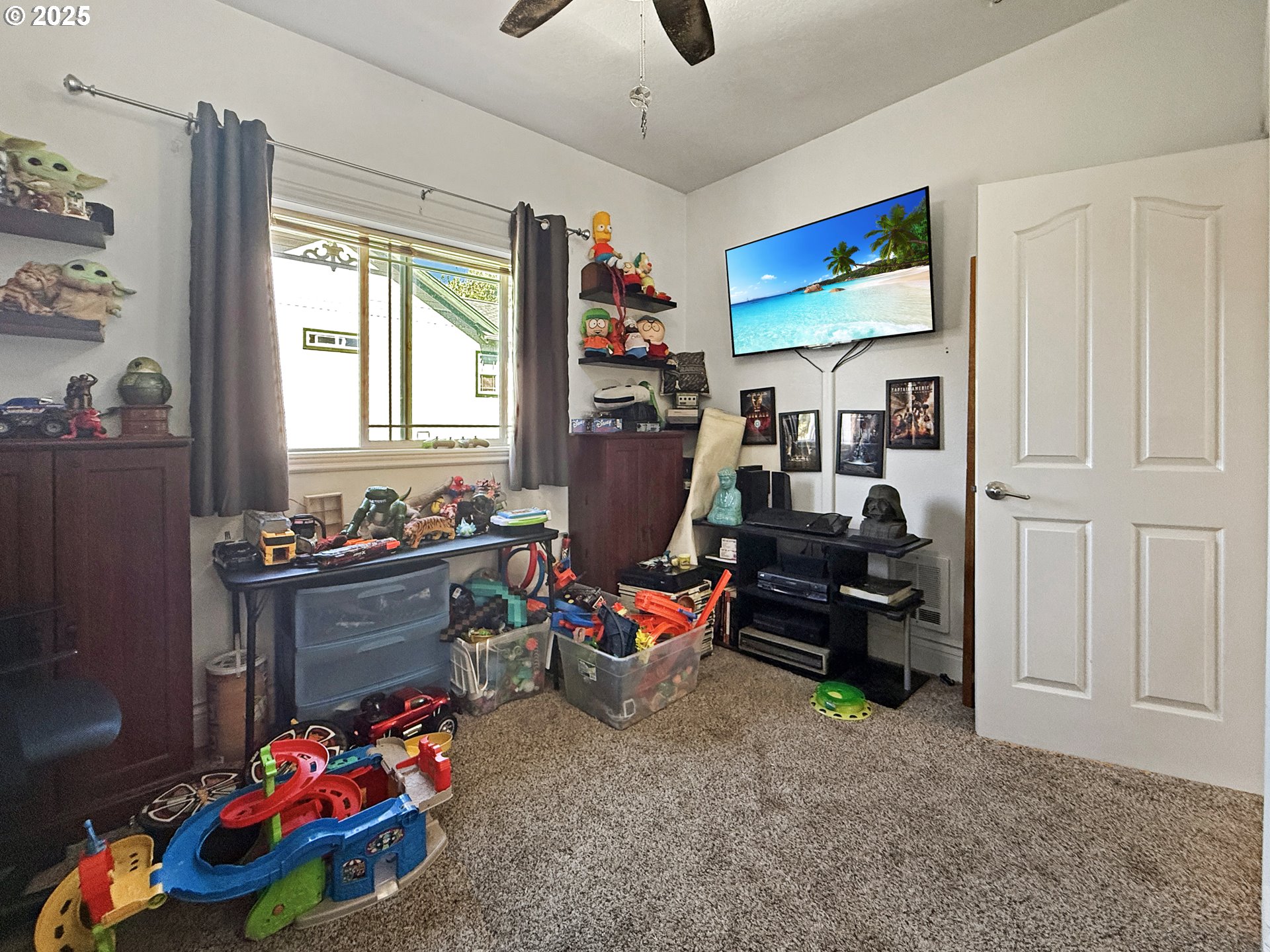 731 3rd Street, Unit C / 3 Brookings, OR 97415 - Photo 40 of 42 a room with furniture toys and a flat screen tv