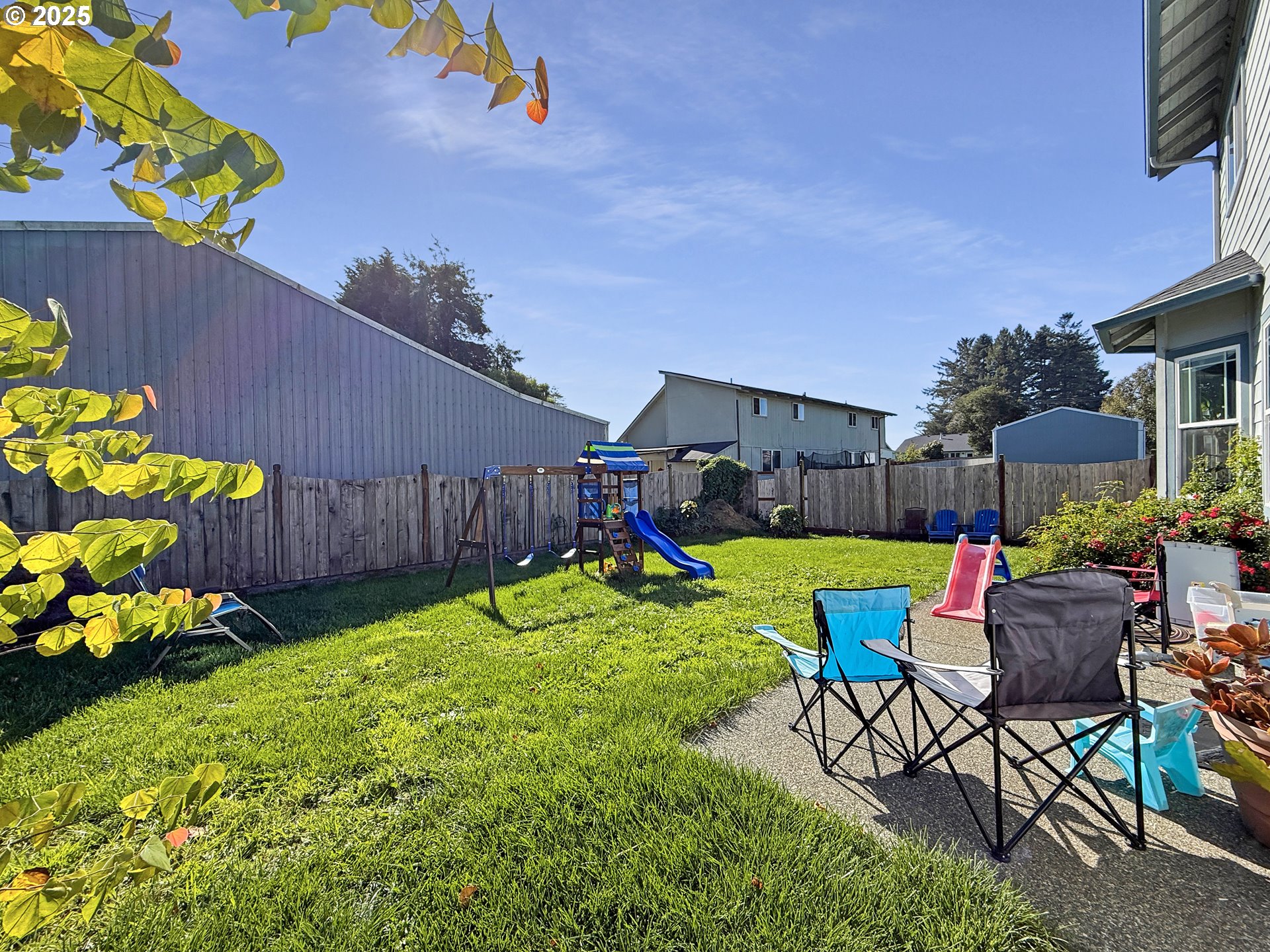 731 3rd Street, Unit C / 3 Brookings, OR 97415 - Photo 7 of 42 a view of a backyard with plants and a patio