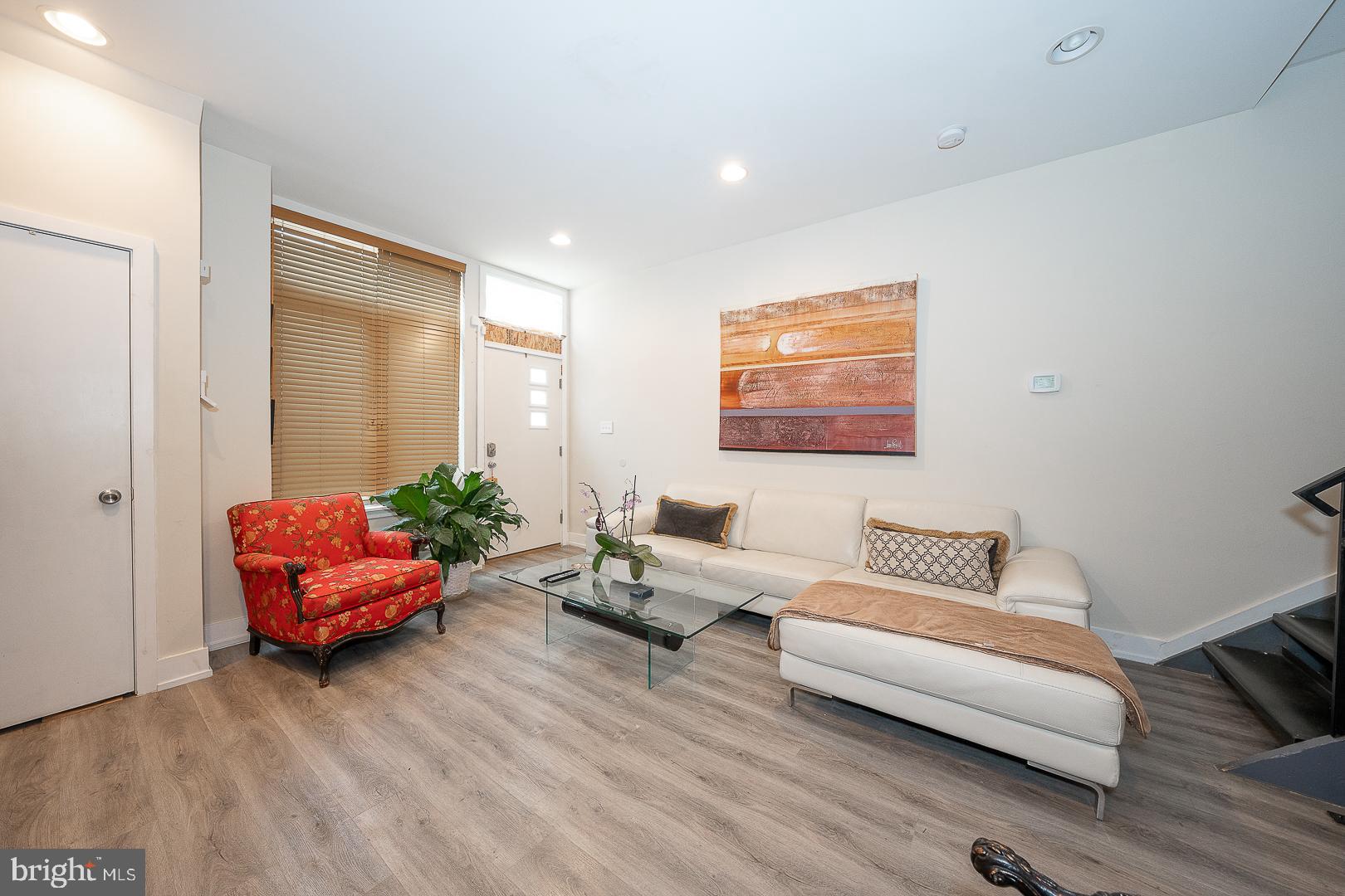 715 Shirley Street, Unit A Philadelphia, PA 19130 - Photo 4 of 24 a living room with furniture and wooden floor