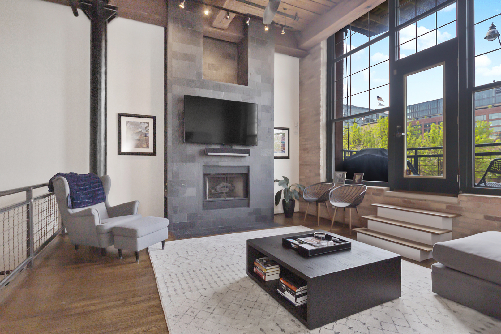 1000 West Washington Boulevard, Unit 142 Chicago, IL 60607 - Photo 5 of 24 a living room with furniture a flat screen tv and a large window