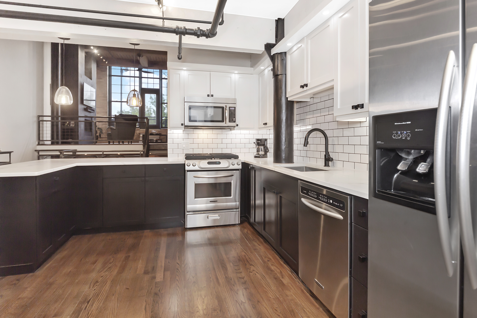 1000 West Washington Boulevard, Unit 142 Chicago, IL 60607 - Photo 10 of 24 a kitchen with stainless steel appliances granite countertop a stove a sink and a refrigerator