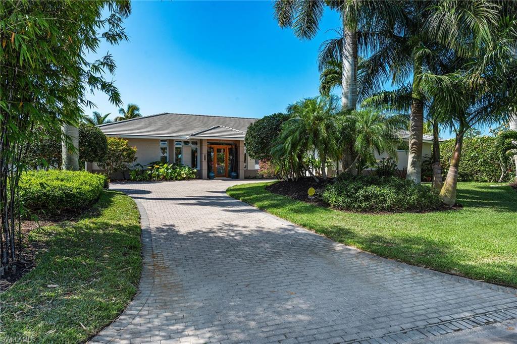 a swimming pool with outdoor seating and yard