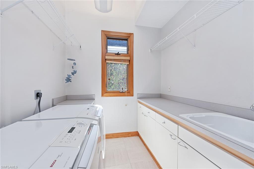 550 Starboard Drive Naples, FL 34103 - Photo 19 of 28 a utility room with dryer and washer
