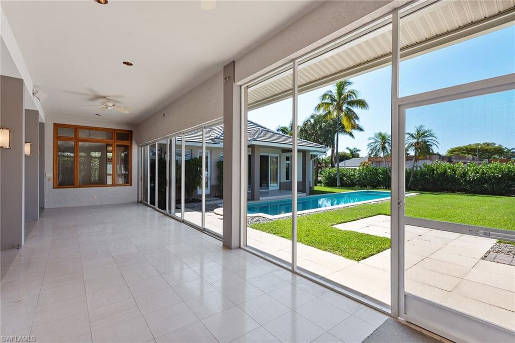 550 Starboard Drive Naples, FL 34103 - Photo 22 of 28 a view of a living room and balcony