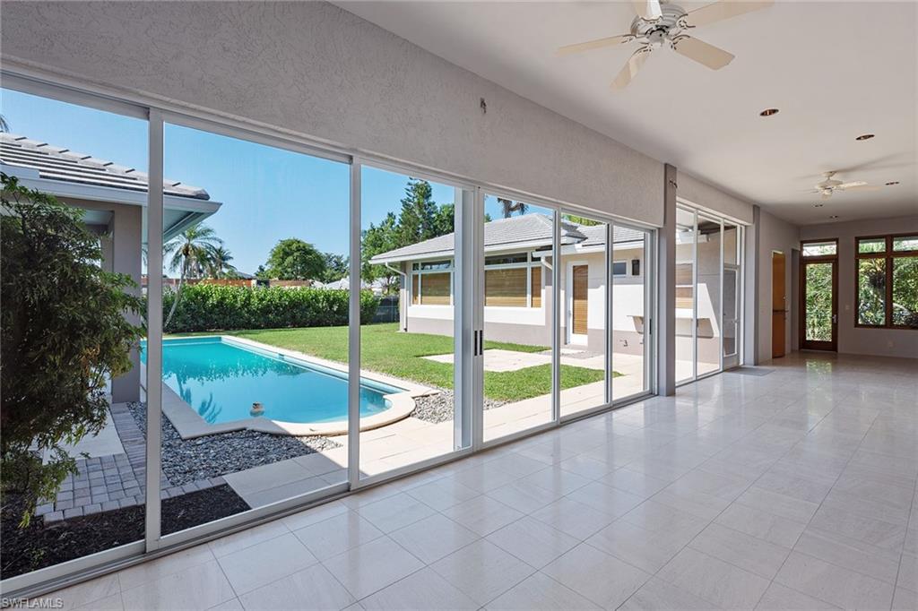 550 Starboard Drive Naples, FL 34103 - Photo 24 of 28 a view of a porch and garden