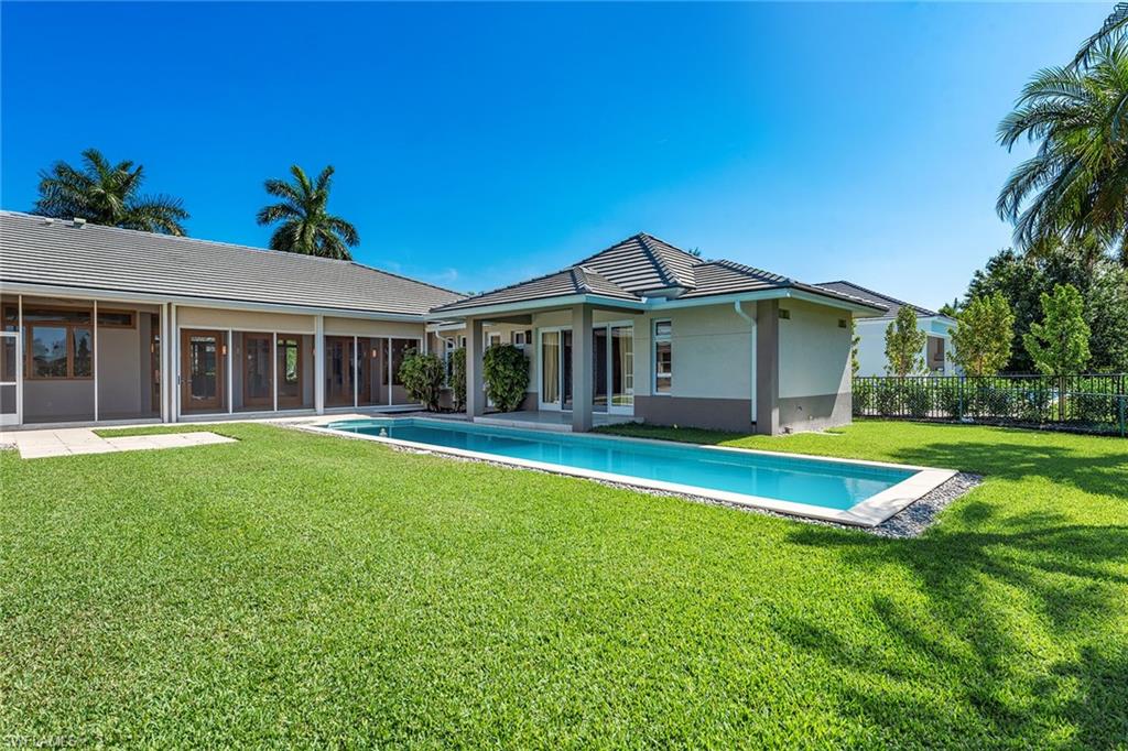 550 Starboard Drive Naples, FL 34103 - Photo 26 of 28 a view of a house with a yard patio and swimming pool