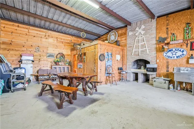 a view of a hallway with workspace and a window