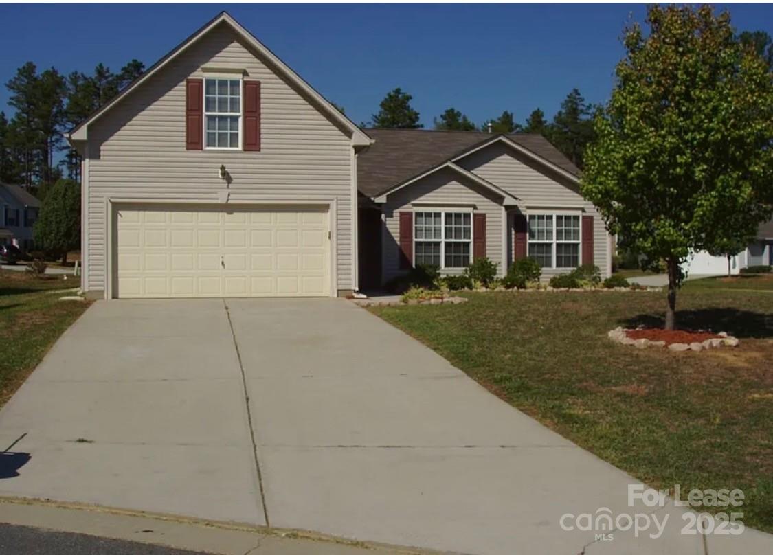1725 Prism Place Kannapolis, NC 28083 - Photo 1 of 1 a front view of a house with a yard