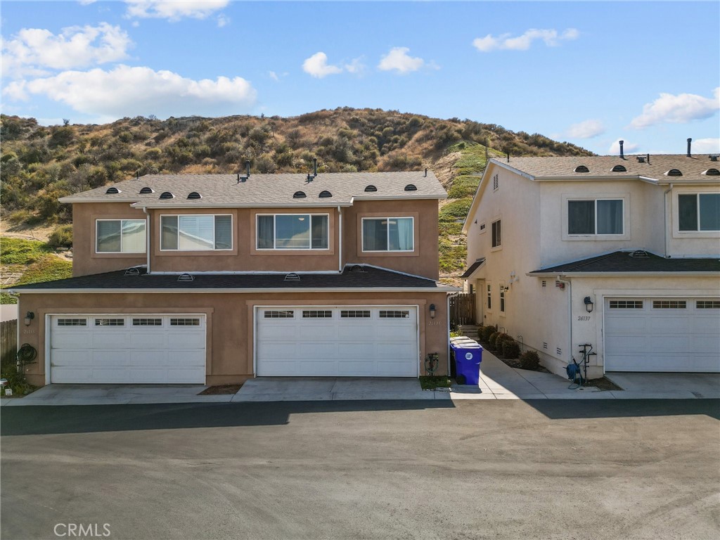 26135 Gravett Place Saugus, CA 91350 - Photo 1 of 31 a view of a big house with a mountain in the background