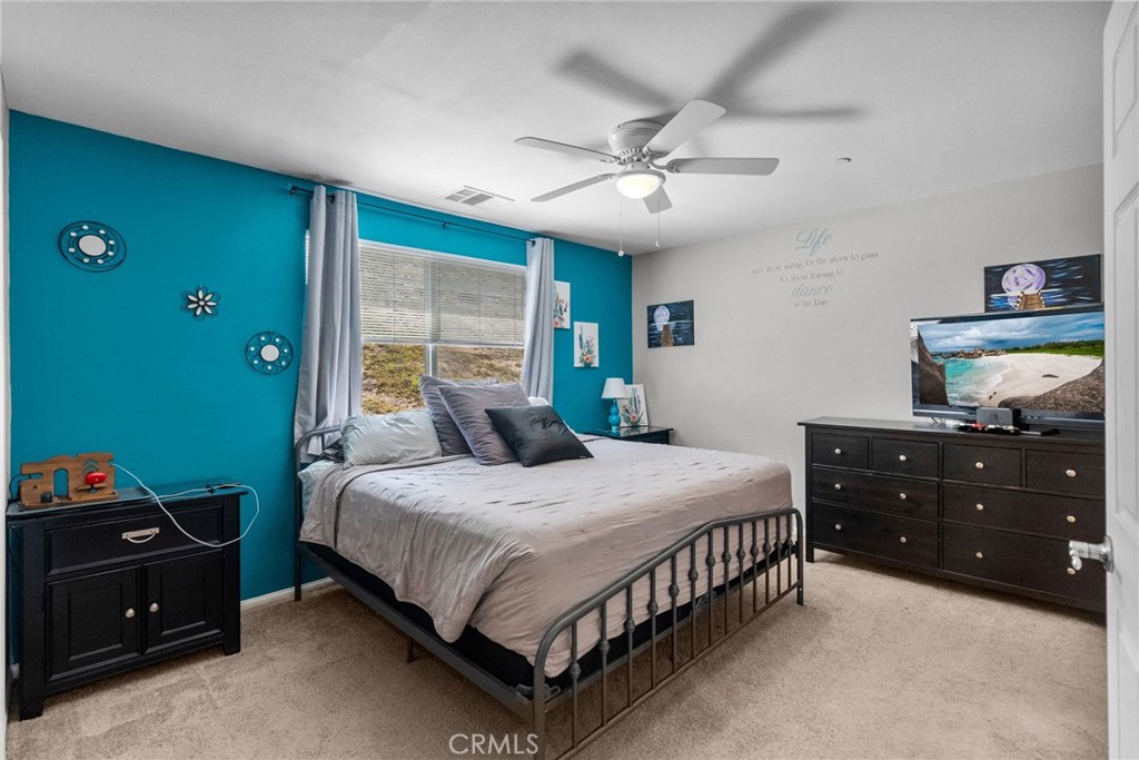 26135 Gravett Place Saugus, CA 91350 - Photo 16 of 31 a bedroom with a bed and a dresser