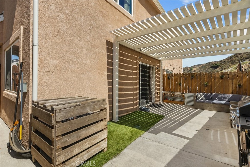 26135 Gravett Place Saugus, CA 91350 - Photo 26 of 31 a view of a patio with a table and chairs