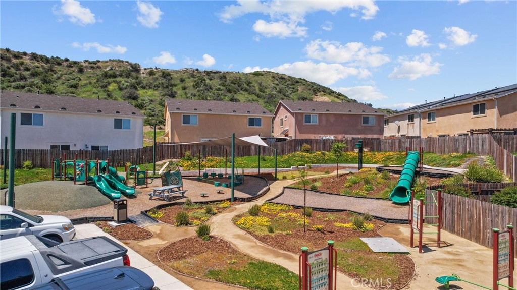 26135 Gravett Place Saugus, CA 91350 - Photo 30 of 31 a view of a house with backyard porch and sitting area