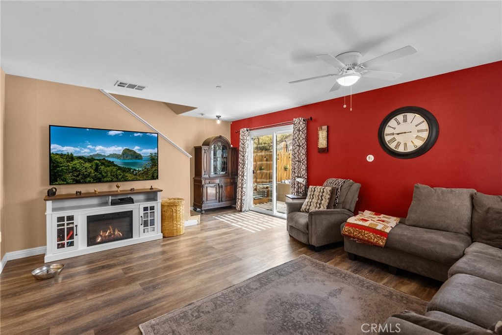 26135 Gravett Place Saugus, CA 91350 - Photo 3 of 31 a living room with furniture and a flat screen tv