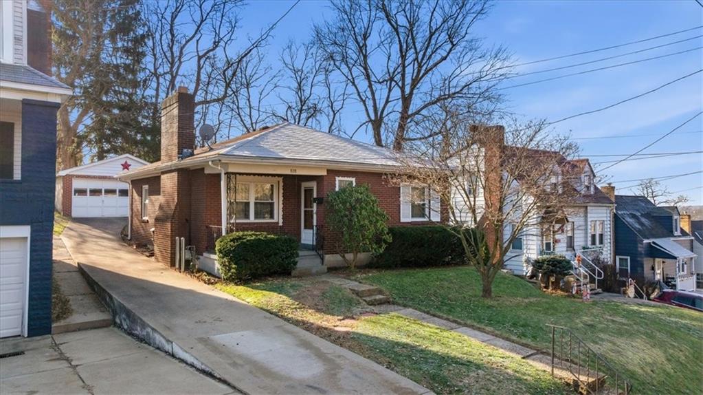 a front view of a house with garden