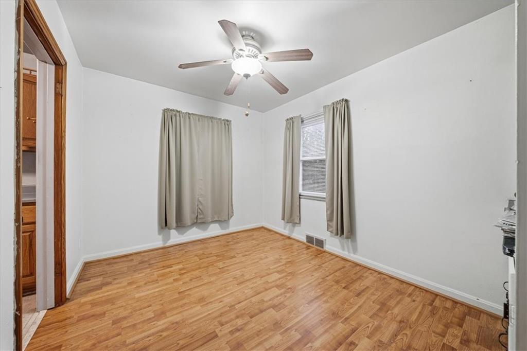 828 Dearborn Street Baden, PA 15005 - Photo 11 of 26 a view of a livingroom with a ceiling fan and wooden floor