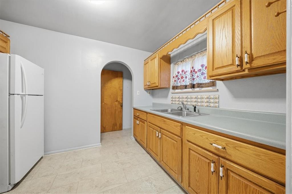 828 Dearborn Street Baden, PA 15005 - Photo 15 of 26 a view of cabinets and window