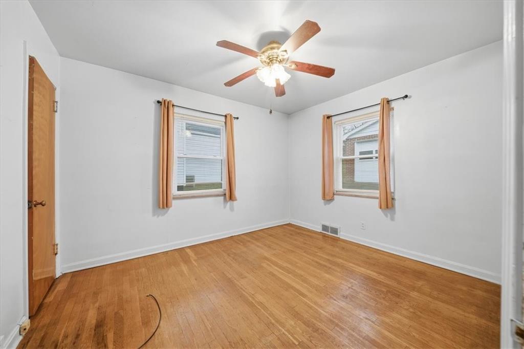 828 Dearborn Street Baden, PA 15005 - Photo 17 of 26 a view of an empty room with a window