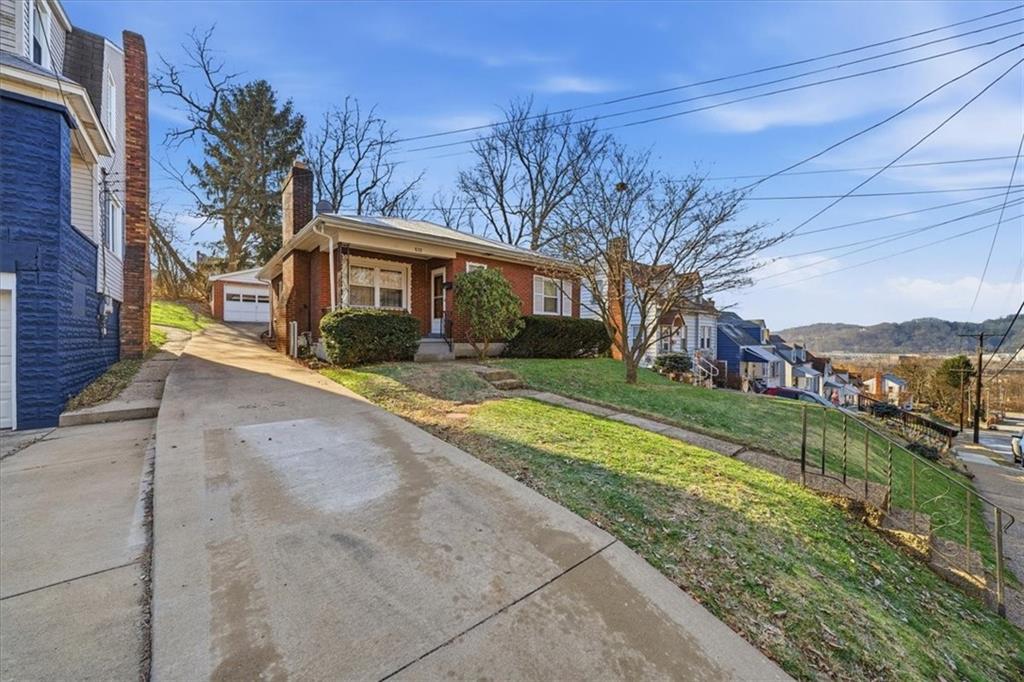 828 Dearborn Street Baden, PA 15005 - Photo 2 of 26 a front view of a house with a yard