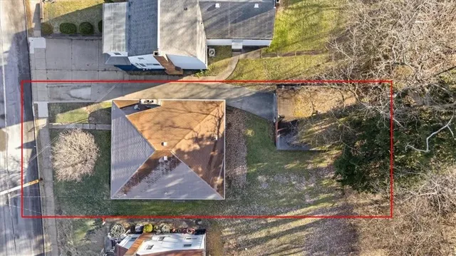 a view of a house with a tree