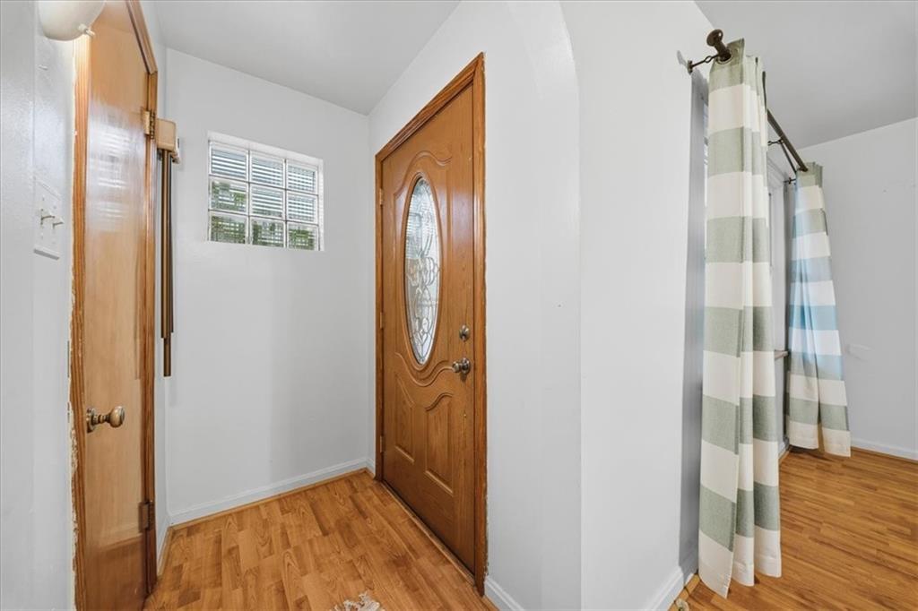 828 Dearborn Street Baden, PA 15005 - Photo 7 of 26 a view of hallway with wooden floor and stairs