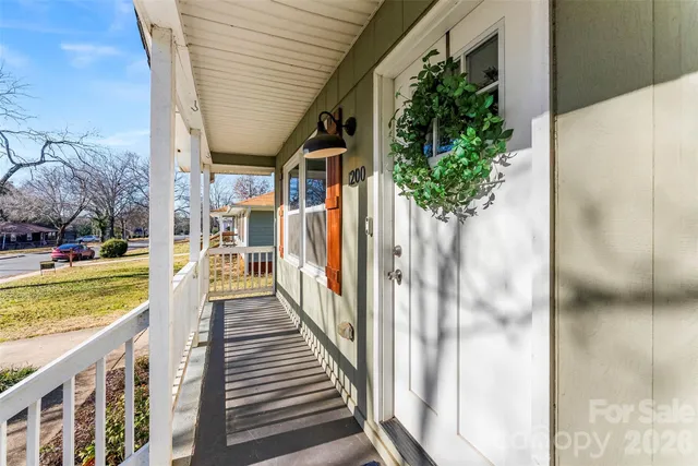 a view of a pathway of a house with a yard