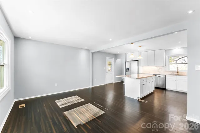 a view of kitchen with cabinets and wooden floor