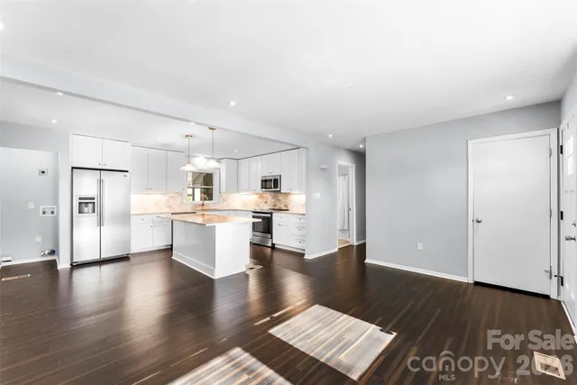 a view of kitchen with wooden floor