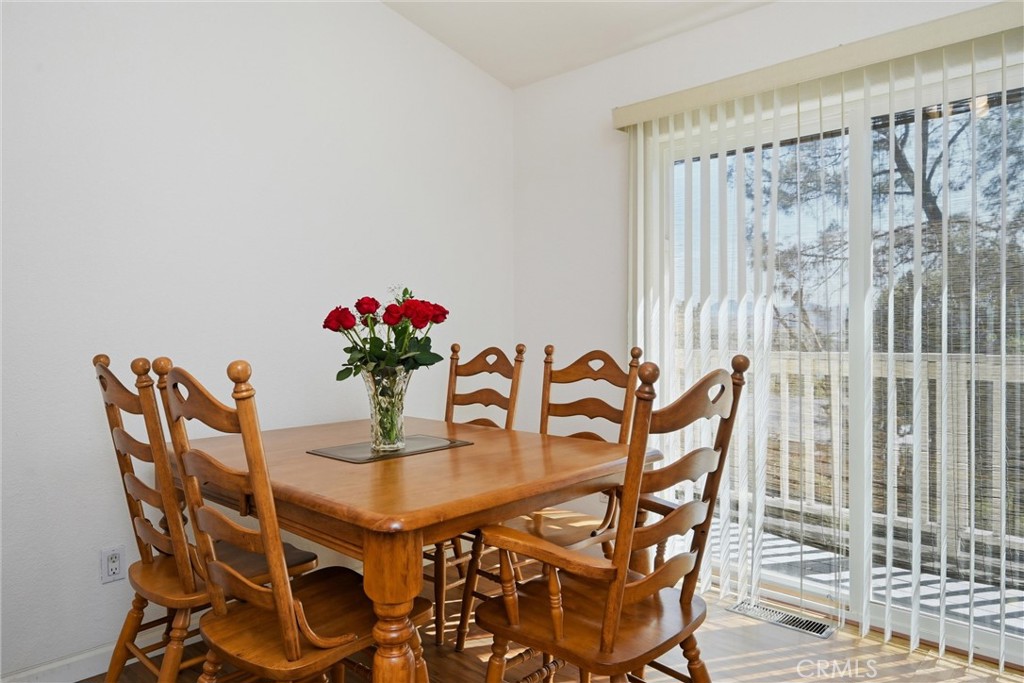 18685 Oak Grove Road Hidden Valley Lake, CA 95467 - Photo 8 of 52 a dining room with furniture and wooden floor