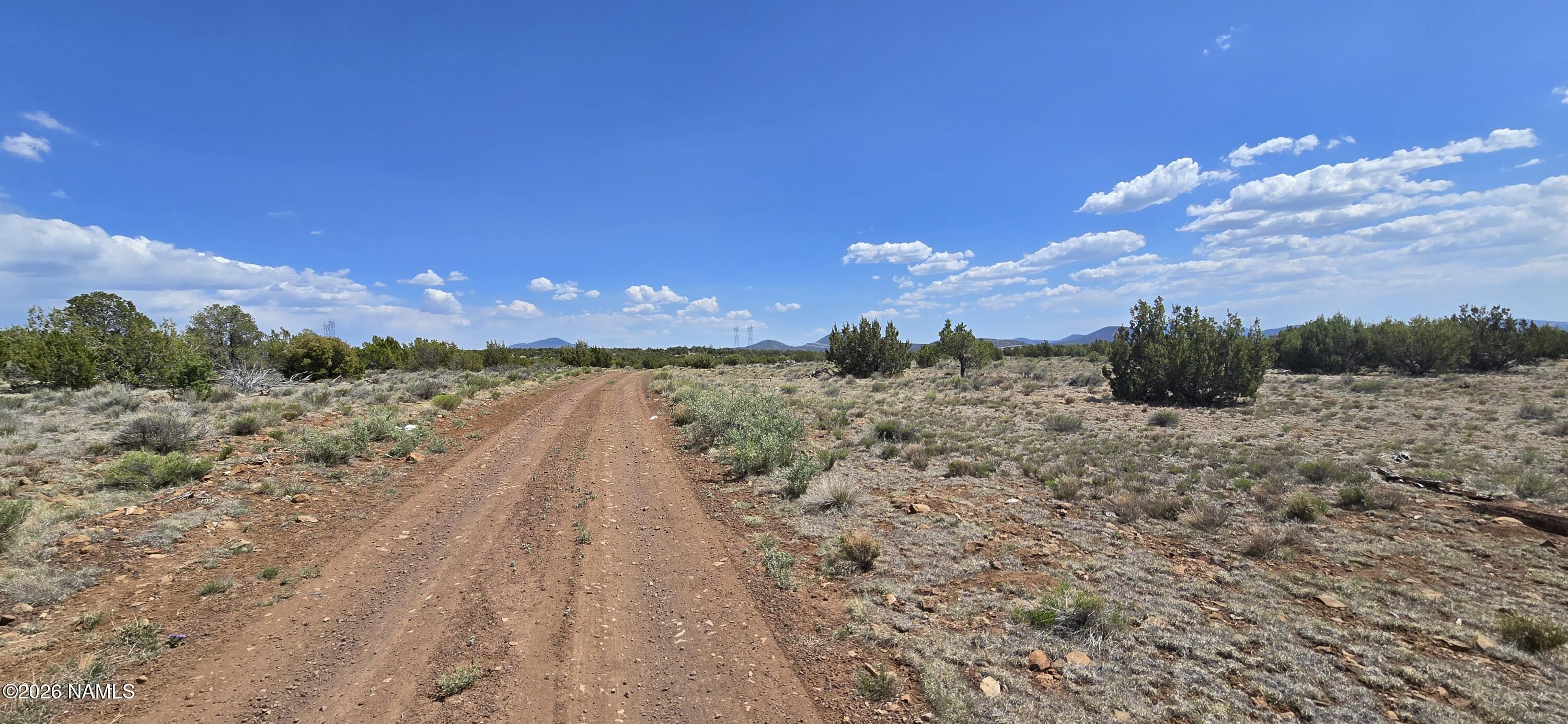 227 Mountain Cat Road Williams, AZ 86046 - Photo 7 of 13 a view of a yard with wooden fence