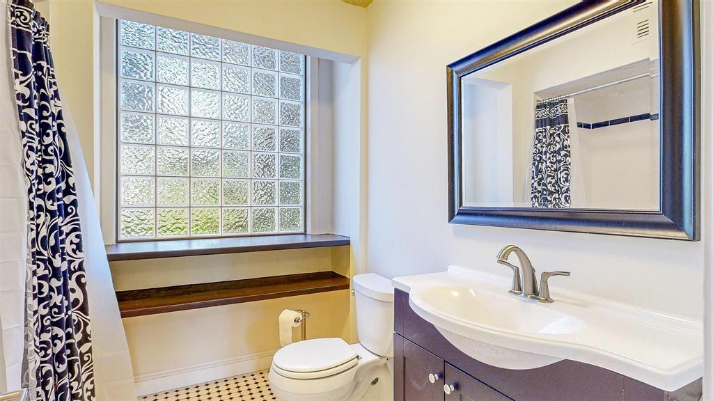 100 Saturn Road St. Augustine, FL 32086 - Photo 17 of 29 a bathroom with a sink a toilet and mirror