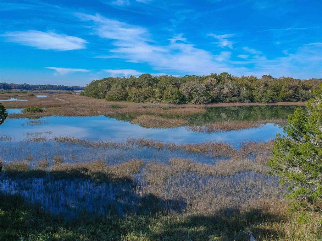 100 Saturn Road St. Augustine, FL 32086 - Photo 22 of 29 a view of a lake with a city