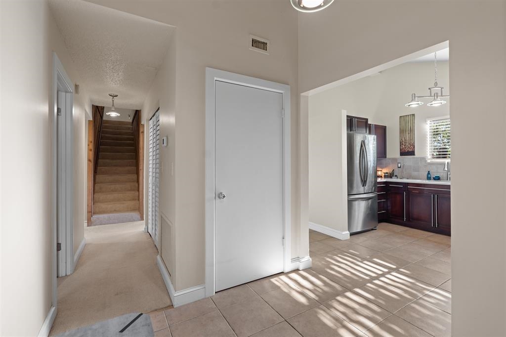 100 Saturn Road St. Augustine, FL 32086 - Photo 6 of 29 a view of a kitchen from the hallway