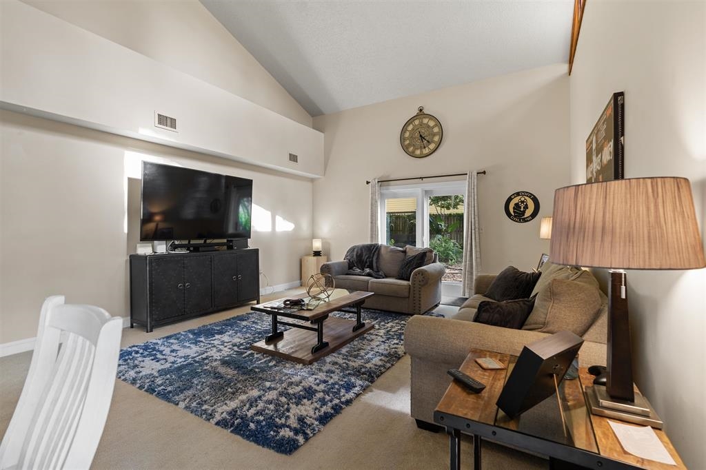 100 Saturn Road St. Augustine, FL 32086 - Photo 8 of 29 a living room with furniture and a flat screen tv