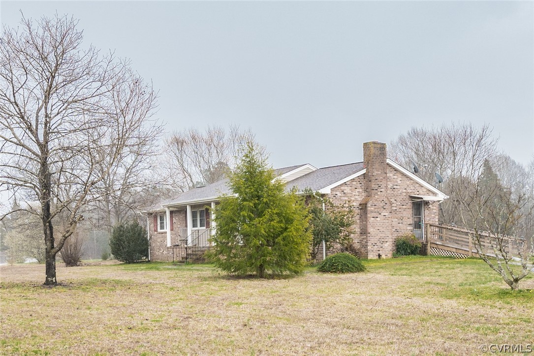 12602 Cox Road Church Road, VA 23833 - Photo 3 of 37 a view of a house with a yard and large tree