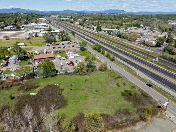 a view of a lake with large trees