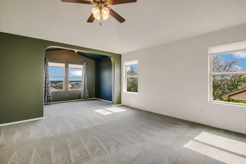 a view of a big room with windows and cabinet