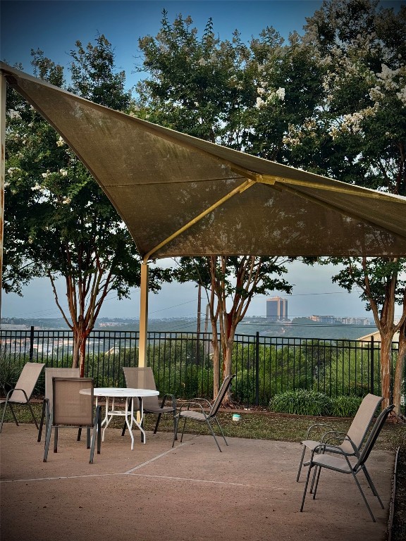 6203 Aviara Drive Austin, TX 78735 - Photo 32 of 33 a view of a patio with table and chairs under an umbrella
