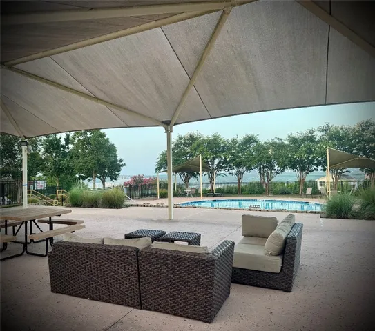 a black and white photo of a white kitchen