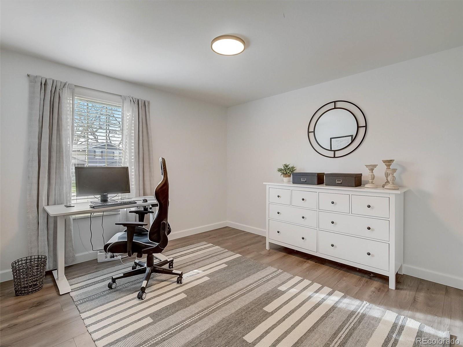 6432 South Birch Circle Centennial, CO 80121 - Photo 22 of 40 a view of a workspace with furniture and a window