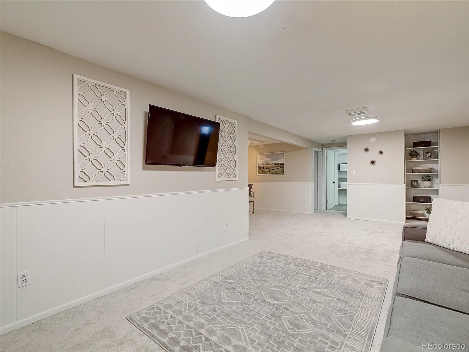 6432 South Birch Circle Centennial, CO 80121 - Photo 27 of 40 a view of a livingroom with an empty space and a couch