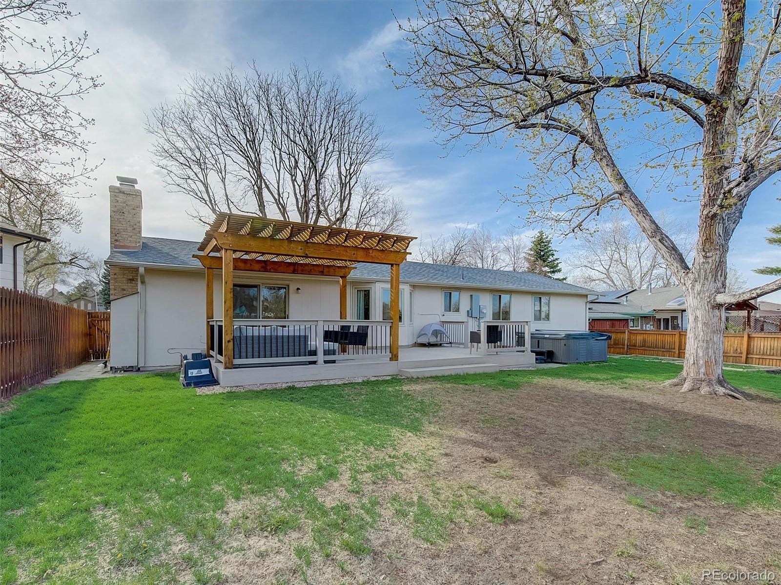 6432 South Birch Circle Centennial, CO 80121 - Photo 37 of 40 a view of a house with a yard and sitting area